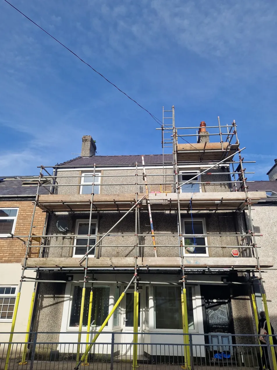 Pebbledash render, scaffolded terrace
