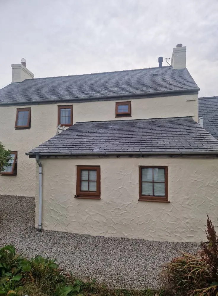 Heavy textured render, stone farmhouse